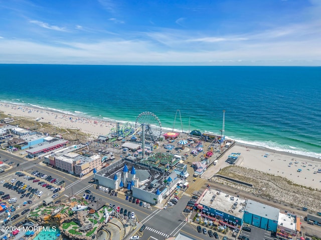 bird's eye view featuring a water view and a view of the beach