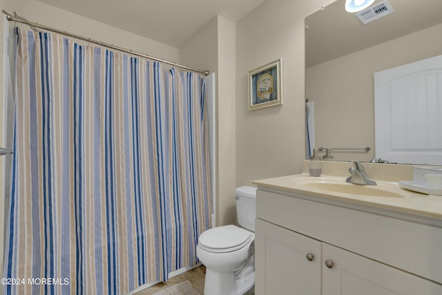 bathroom with a shower with curtain, vanity, and toilet