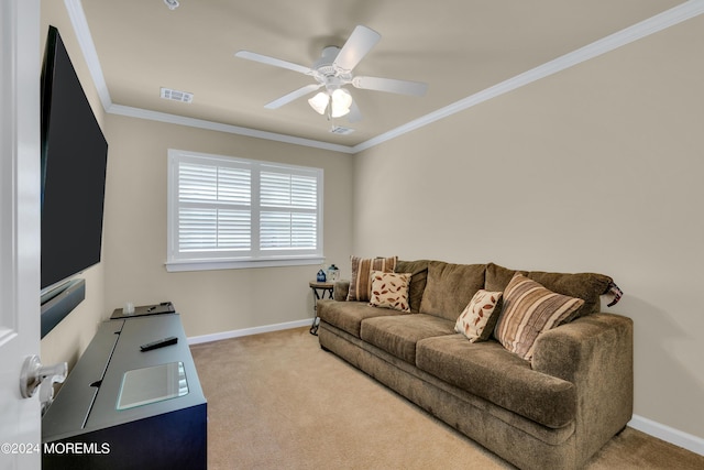 carpeted living room with ceiling fan and ornamental molding