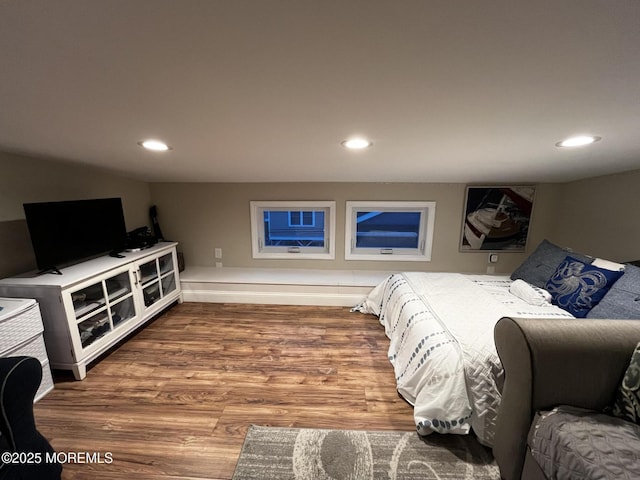 bedroom with hardwood / wood-style floors