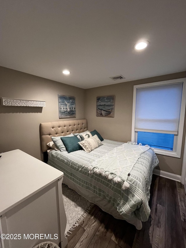 bedroom featuring dark wood-type flooring