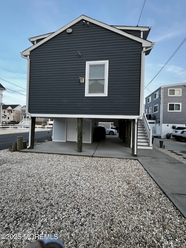 view of side of property with a carport