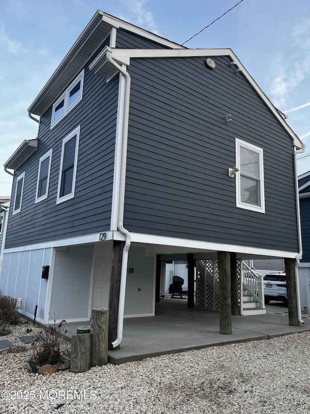 view of home's exterior with a carport