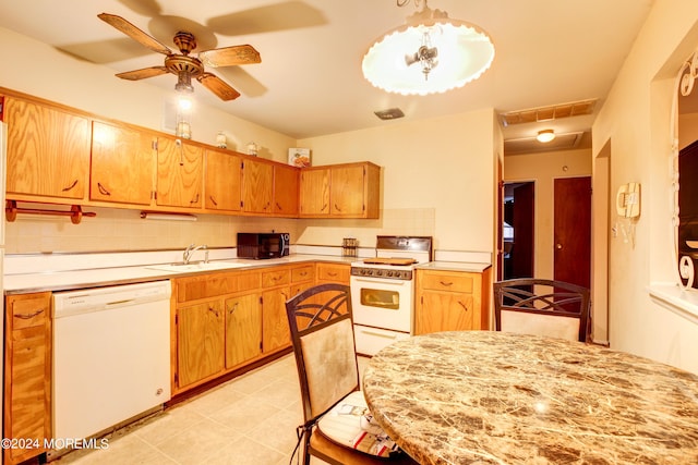 kitchen with sink, white appliances, ceiling fan, tasteful backsplash, and decorative light fixtures