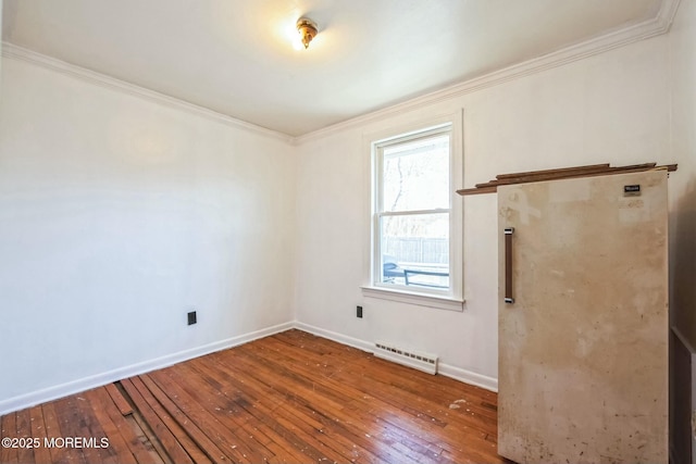 unfurnished room featuring wood-type flooring and ornamental molding