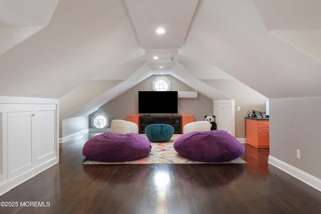 interior space featuring dark hardwood / wood-style flooring and vaulted ceiling