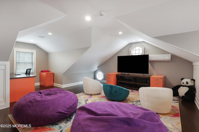 interior space with vaulted ceiling, a wealth of natural light, and dark hardwood / wood-style flooring