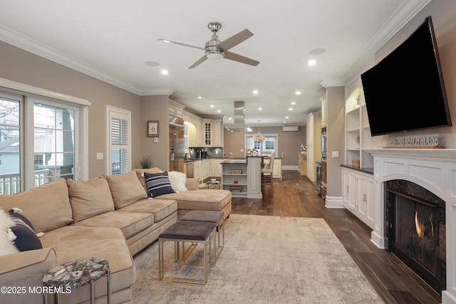 living room with crown molding, dark hardwood / wood-style flooring, and a wealth of natural light