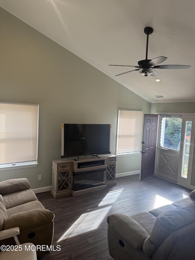 living room with ornamental molding, lofted ceiling, hardwood / wood-style floors, and ceiling fan