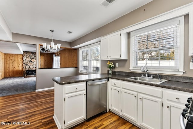 kitchen featuring appliances with stainless steel finishes, kitchen peninsula, and white cabinets