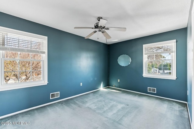 carpeted empty room with ceiling fan