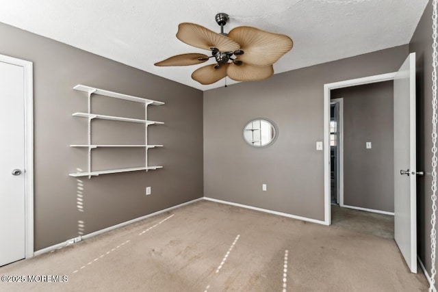 unfurnished bedroom featuring light carpet and ceiling fan