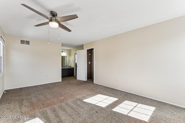 empty room with ceiling fan and carpet