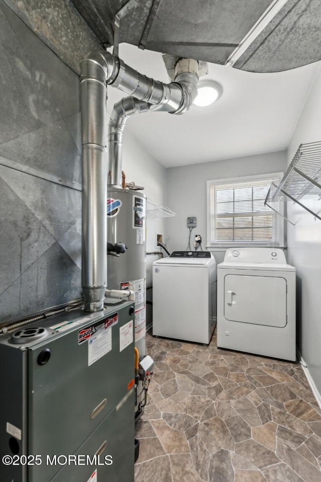 laundry area featuring independent washer and dryer and water heater