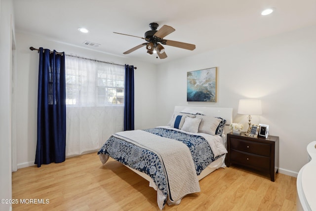 bedroom featuring ceiling fan and light wood-type flooring