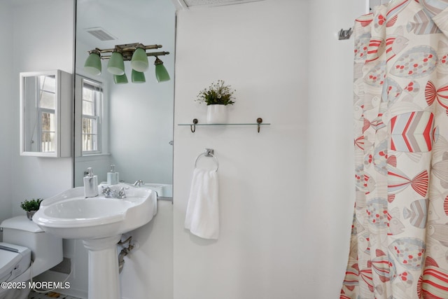 bathroom featuring toilet