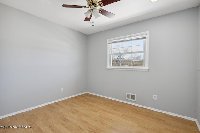 unfurnished room featuring ceiling fan and light wood-type flooring