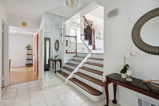 stairs featuring tile patterned flooring