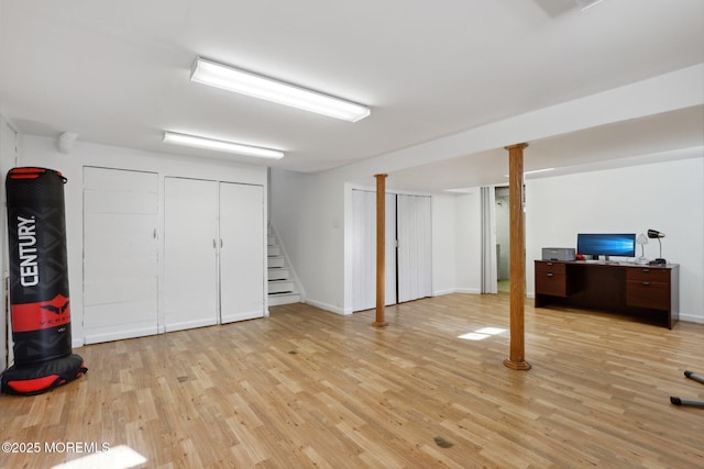 basement with light hardwood / wood-style floors