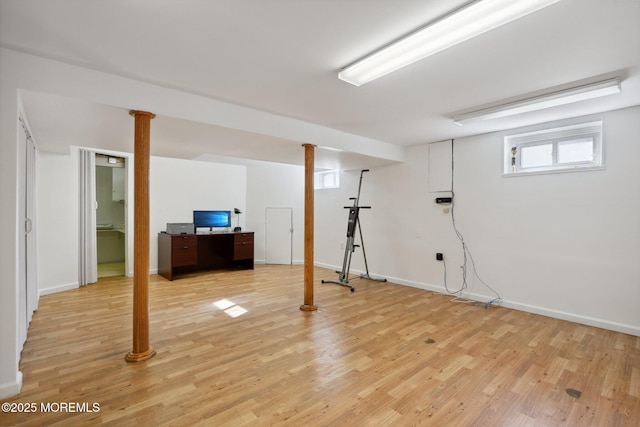 basement with light hardwood / wood-style floors