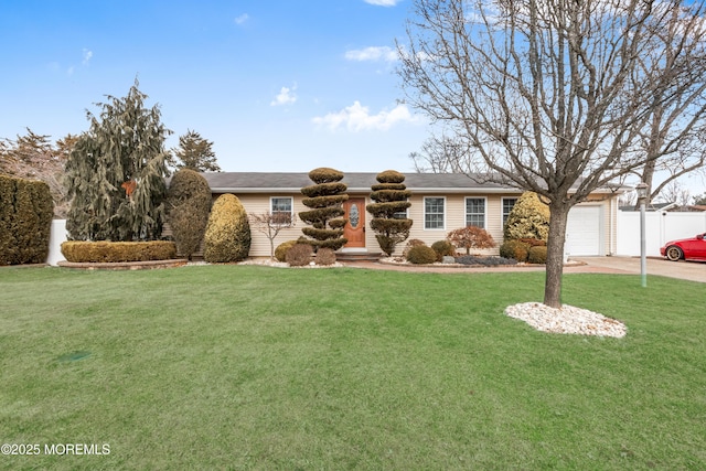 view of front facade with a garage and a front yard