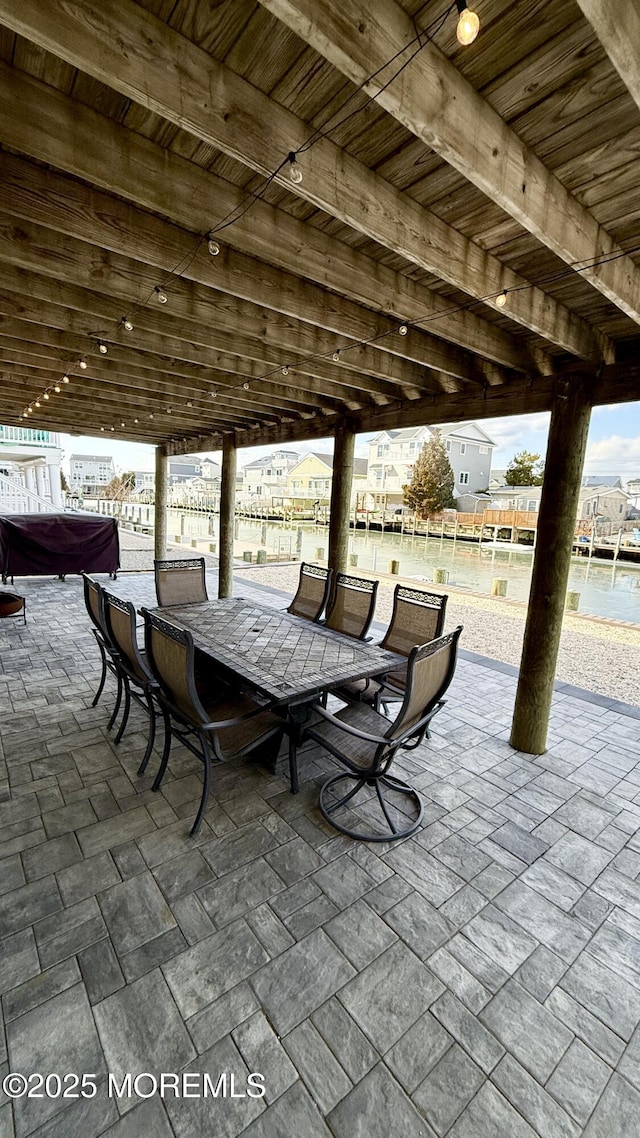 view of patio featuring a water view