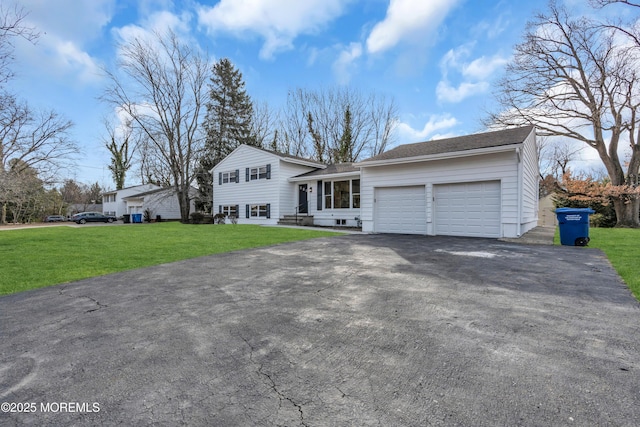 view of front of home featuring a garage and a front yard