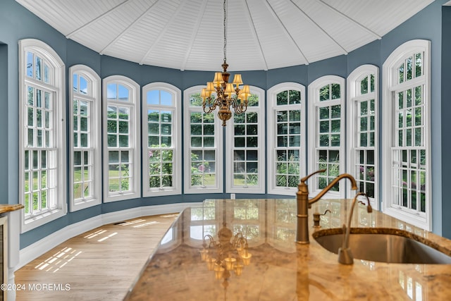 sunroom featuring sink and a notable chandelier