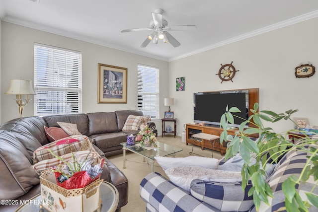 living area with crown molding, ceiling fan, and light colored carpet