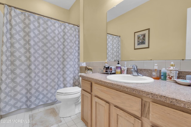 full bathroom with vanity, toilet, and tile patterned floors