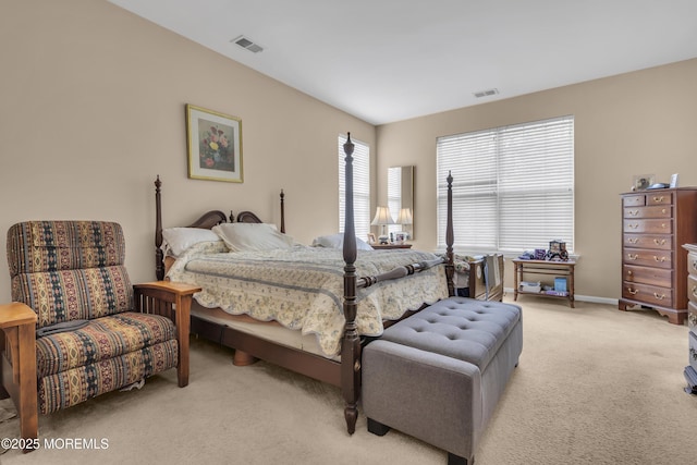 bedroom featuring light carpet, baseboards, and visible vents