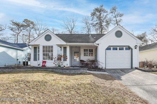 ranch-style house featuring a garage, a front yard, and covered porch