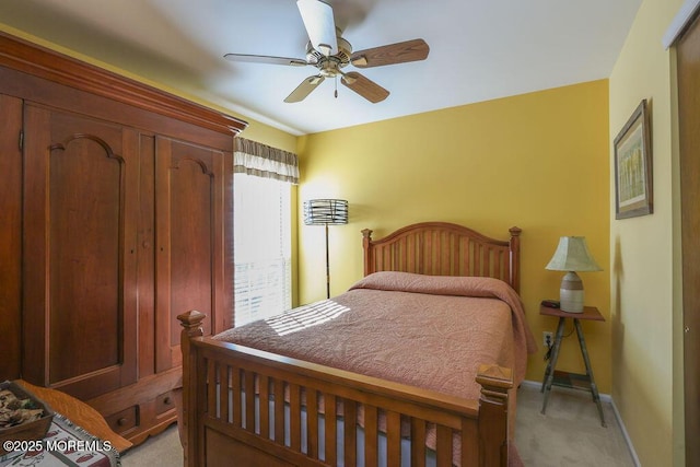 bedroom with light colored carpet and ceiling fan