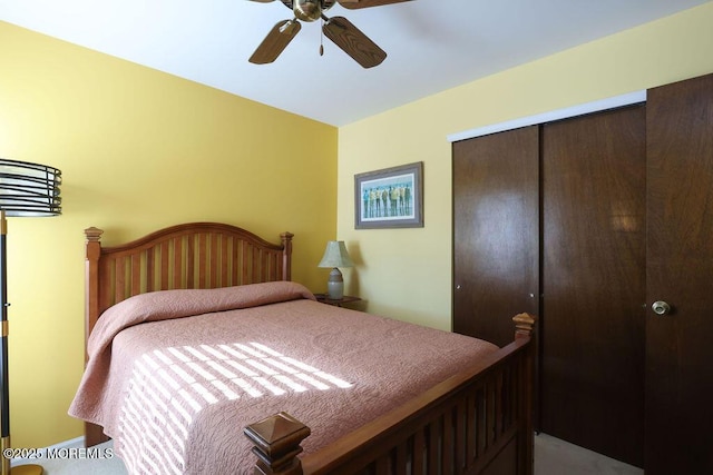 bedroom with ceiling fan and a closet