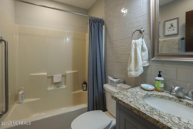 full bathroom with toilet, tile walls, vanity, shower / bath combination with curtain, and backsplash