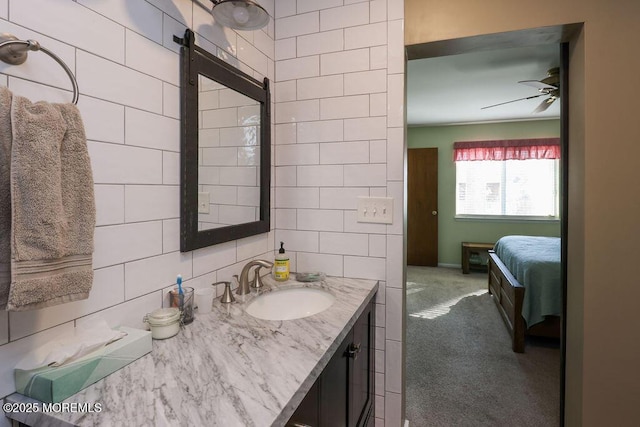 bathroom with vanity, tasteful backsplash, tile walls, and ceiling fan