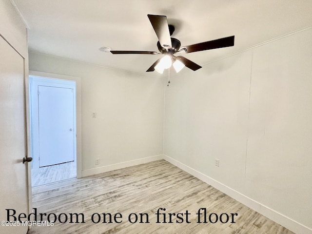 empty room featuring ceiling fan and light wood-type flooring