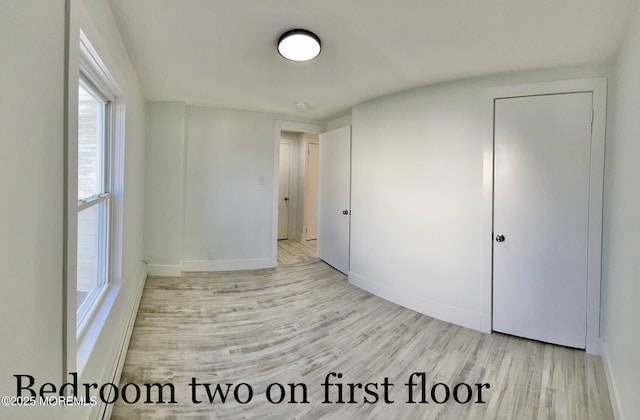 unfurnished bedroom featuring light hardwood / wood-style flooring