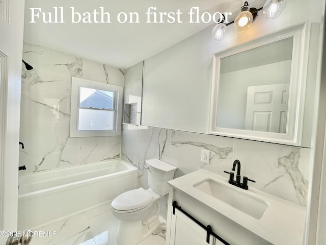 full bathroom featuring vanity, toilet, tiled shower / bath combo, and tile walls