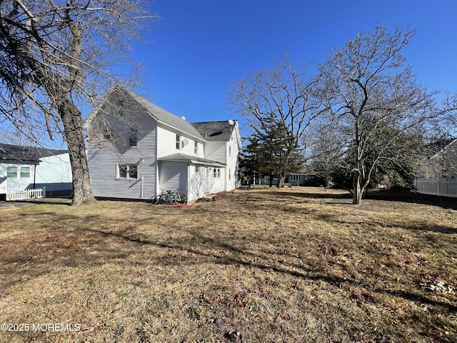 view of home's exterior with a yard