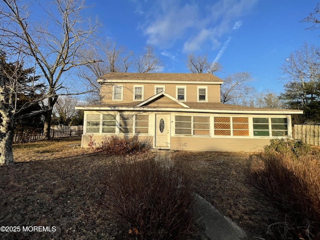 front facade with a sunroom