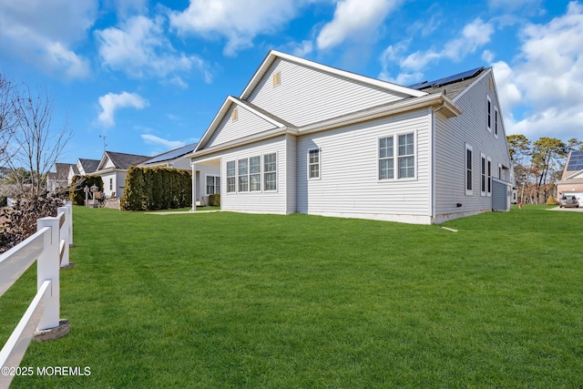 back of house featuring a yard