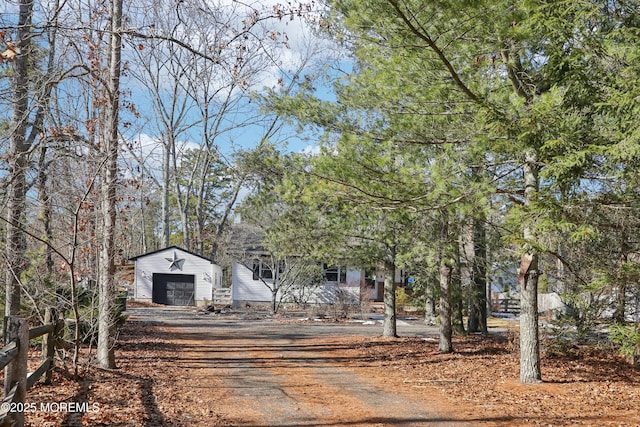 view of front of home featuring an outbuilding and a garage