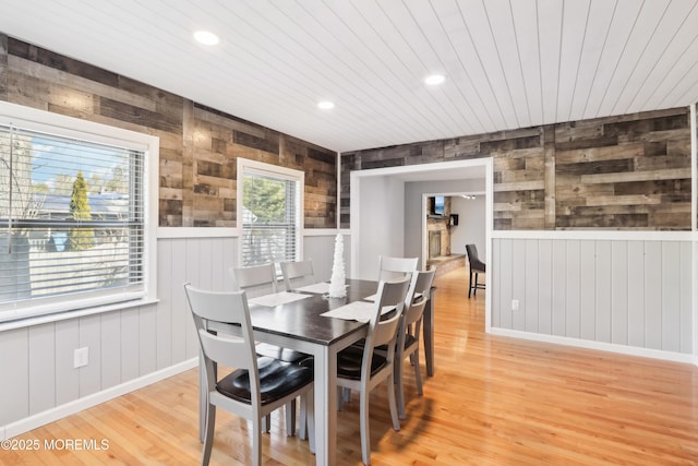 dining room featuring hardwood / wood-style flooring and wooden ceiling