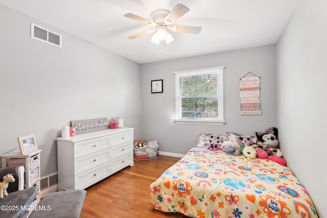 bedroom with ceiling fan and light hardwood / wood-style flooring