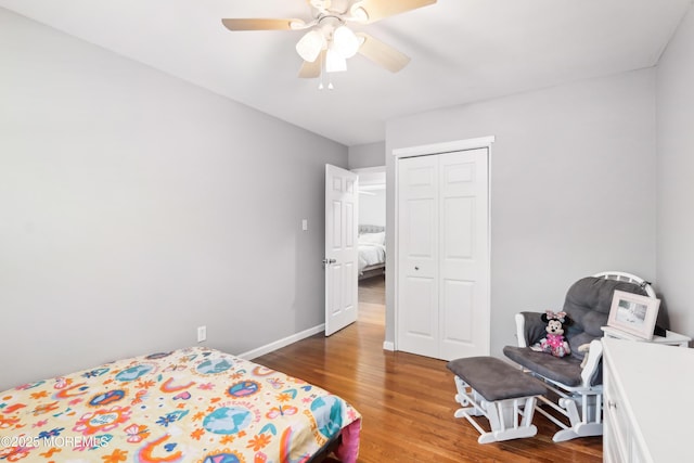 bedroom featuring hardwood / wood-style flooring, a closet, and ceiling fan