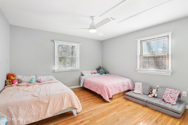 bedroom with wood-type flooring and ceiling fan