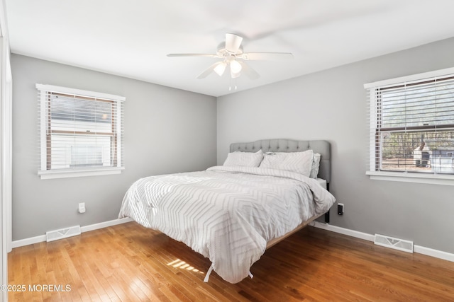 bedroom with wood-type flooring and ceiling fan