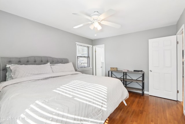 bedroom featuring dark hardwood / wood-style floors and ceiling fan