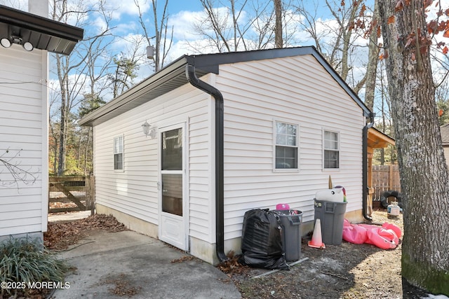 view of property exterior with a patio